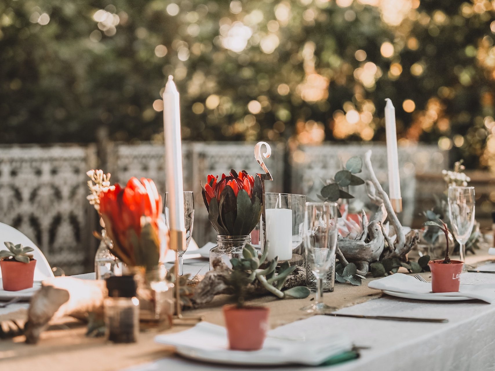 red roses in clear glass vase on table